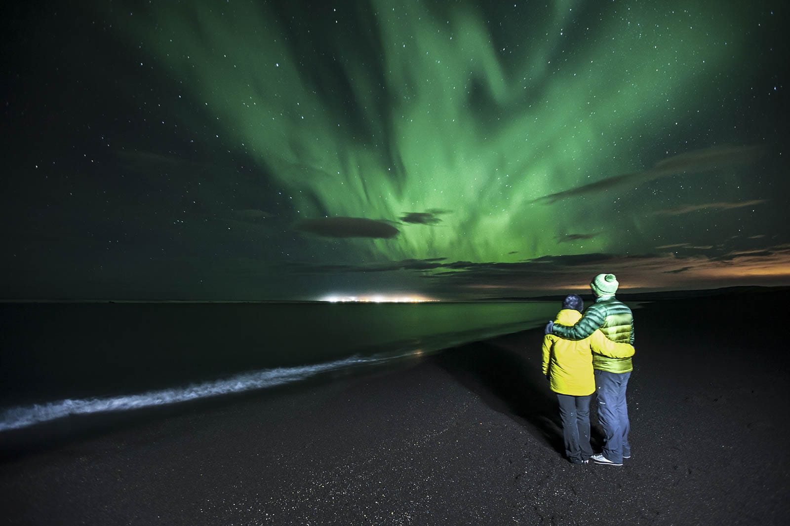 By the ocean looking at the northern lights