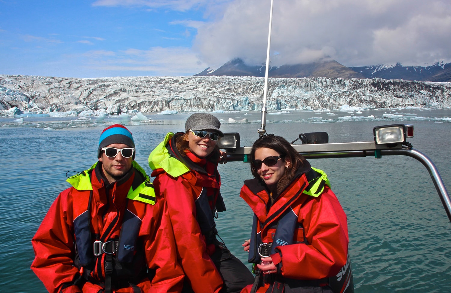 Happy people exploring the glacier lagoon